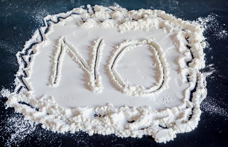 NO word write in white powder, black background, no drugs, close up.の写真素材