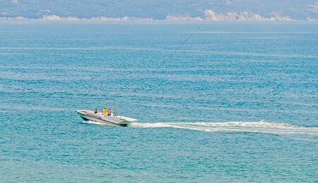 ALBENA, BULGARIA - JUNE 15, 2016. Recreation parasailing boat, ship sailing on Black Sea, blue water, sunny day and clear skyのeditorial素材