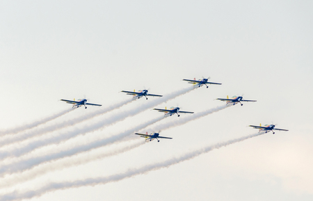 BUCHAREST, ROMANIA - JULY 30, 2016. The Romanian Hawks Team pilots with their colored airplanes training in the blue sky.  Bucharest International Air Show.のeditorial素材