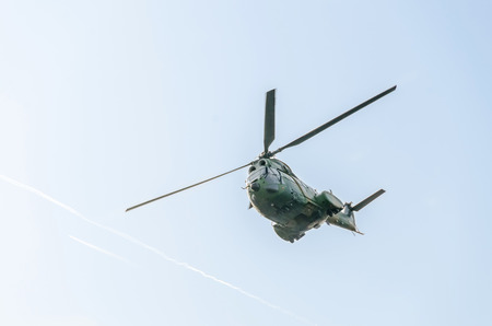 BUCHAREST, ROMANIA - SEPTEMBER 5, 2015. Aerobatic elicopter pilots training in the sky of the city. Puma elicopter, navy, army drill.のeditorial素材