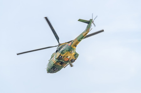 BUCHAREST, ROMANIA - SEPTEMBER 5, 2015. Aerobatic elicopter pilots training in the sky of the city. Puma elicopter, navy, army drill.のeditorial素材