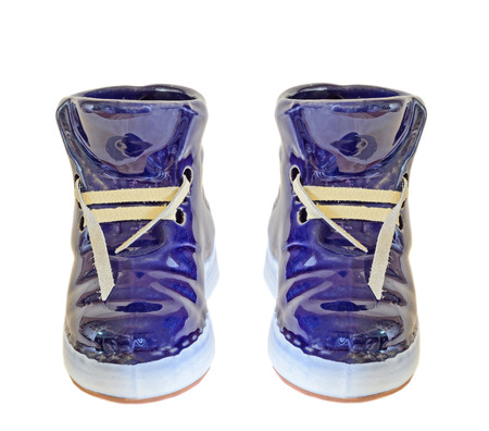 Blue ceramic boots, sneakers, close up, isolated, white background.の写真素材