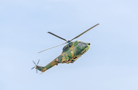 BUCHAREST, ROMANIA - SEPTEMBER 5, 2015. Aerobatic elicopter pilots training in the sky of the city. Puma elicopter, navy, army drill.のeditorial素材