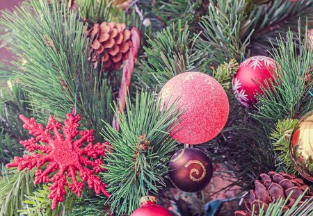 Christmas tree vibrant colored ornaments, globe hanging, snow flake, stars, green tree, firs with...