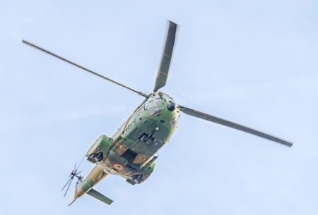 BUCHAREST, ROMANIA - SEPTEMBER 5, 2015. Aerobatic elicopter pilots training in the sky of the city. Puma elicopter, navy, army drill.のeditorial素材