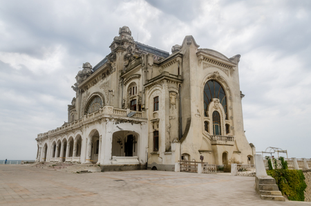 CONSTANTA, ROMANIA - SEPTEMBER 4, 2014: Visiting the old building named "Cazino" (Casino) near see side and port.のeditorial素材