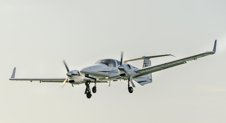 BUCHAREST, ROMANIA - OCTOBER 4, 2014: Aerobatic airplane pilot training in the sky of the city.