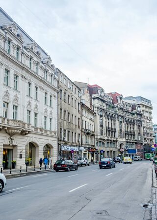 BUCHAREST, ROMANIA - MAY 25, 2014: Victoria Avenue (Calea Victoriei) with old, vintage buildings.のeditorial素材