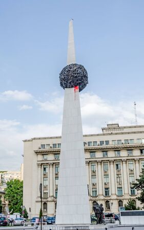 BUCHAREST, ROMANIA - MAY 25, 2014: The Revolution Square. The statue called "Memorialul Renasterii" by Alexandru Ghildusのeditorial素材