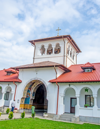 PLOIESTI, ROMANIA - APRIL 22, 2014. The Monastery Ghighiu build in 16 century with miracle icon and healing spring. Exterior detailのeditorial素材