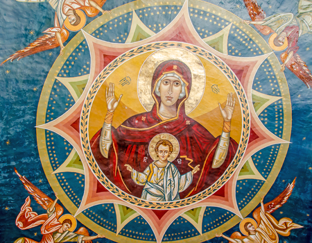 PLOIESTI, ROMANIA - APRIL 22, 2014. The Monastery Ghighiu build in 16 century with miracle icon and healing spring. Detail of the exterior painting.のeditorial素材