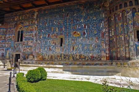 MOLDOVA, ROMANIA - JULY 4,  2014. Visiting the Monastery Voronet. Details of painted exterior walls. Dominant color is well known blue of Voronet.のeditorial素材
