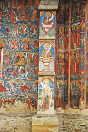 MOLDOVA, ROMANIA - JULY 4,  2014. Visiting the Monastery Voronet. Details of painted exterior walls. Dominant color is well known blue of Voronet.のeditorial素材