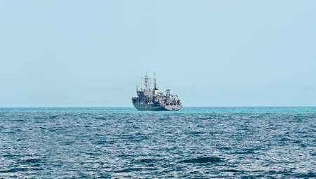 Boat or ship navigating on blue Black Sea water, cargoboat.の写真素材