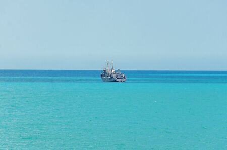 Boat or ship navigating on blue Black Sea water, cargoboat.の写真素材
