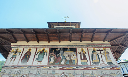 VALEA JIULUI, ROMANIA - AUGUST 1, 2017: The old Lainici Monastery on a summer's day, detail of the exterior painted wall.のeditorial素材