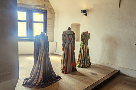 HUNEDOARA, ROMANIA - AUGUST 5, 2017: Details from the interior room of the Corvins Castle build by John Hunyadi, women clothesのeditorial素材