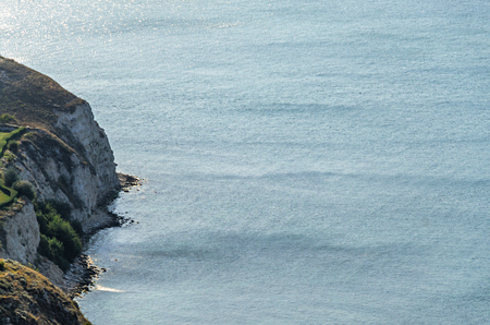 Green Thracian cliffs near blue clear water of Black Sea, rocky path seaview.