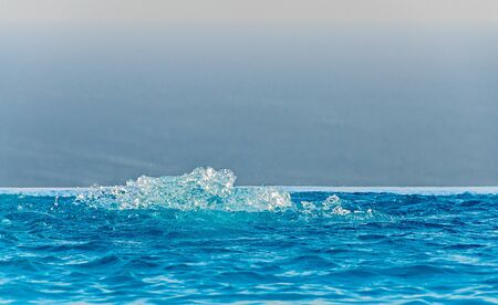 Infinity pool with crystal blue water view to sea  ocean.