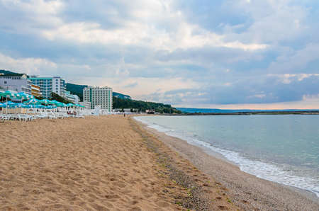 Beach of Black Sea from Golden Sands, Bulgaria with blue clear water, fluffy clouds sky, hotelsの写真素材