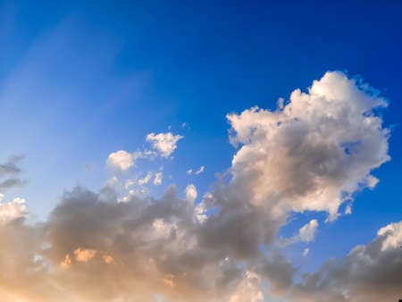 Spectacular blue sky with mistic clouds and rays of lightsの写真素材