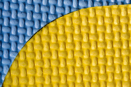 colorful foam floor background. yellow and blue
