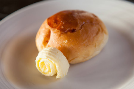 Butter curl and brown bread 