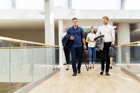 Business in motion, walking business peopleの写真素材