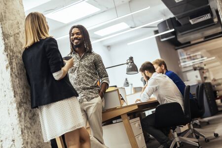 Business colleagues talking in the officeの写真素材