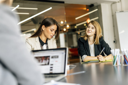 Beautiful businesswoman working in office and smilingの写真素材