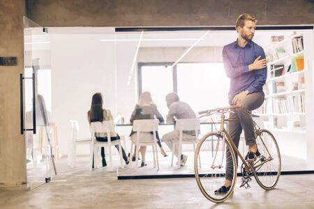 Businessman riding a bicycle to work