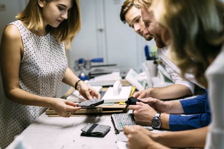 creative coworkers putting their imagination to the test in designing clothesの写真素材