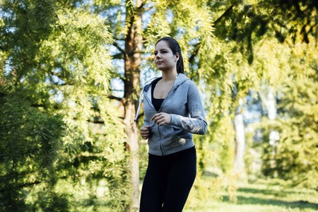 Beautiful woman jogging in  a park