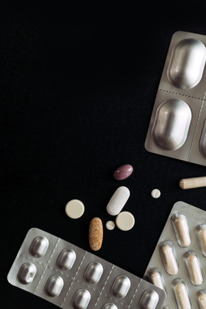 Antibiotics and medication on a dark backgroundの写真素材