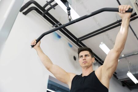 Handsome man working out in gym