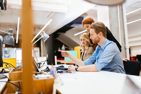 Businesspeople working in modern office and collaboratingの写真素材