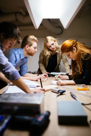 Group of designer working on project in workshop