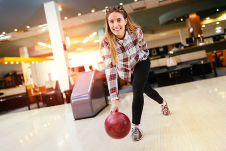 Beautiful woman enjoying  bowlingの写真素材