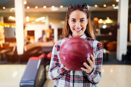 Beautiful woman enjoying  bowlingの写真素材