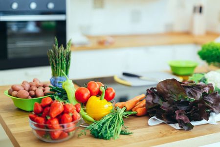 Fresh vegetables and fruit on kitchen counterの写真素材