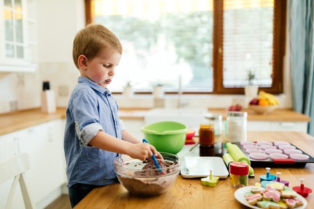 Cute child learning to become a chef  since the age of 2の写真素材