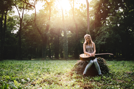 Depressed girl filling void after breakup in natureの写真素材