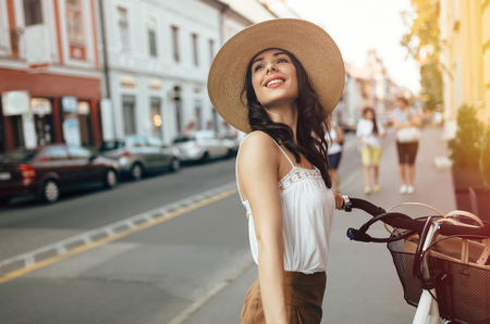 Tourist woman using bicycle as means of transportationの写真素材