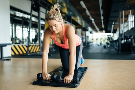 Tired athlete working out in gym