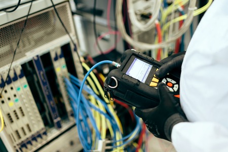 Technician repairing cmts networking cards