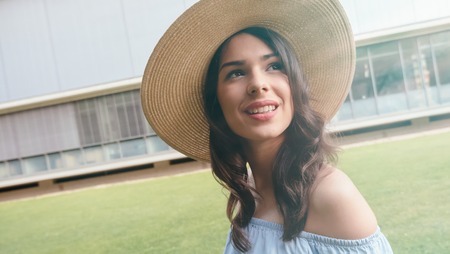 Beautiful smiling woman wearing a hat
