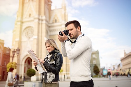 Tourist couple enjoying sightseeing and exploring city