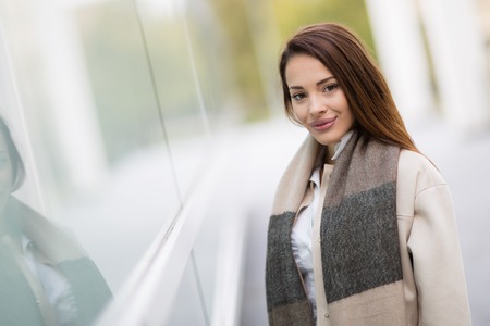 Beautiful smiling woman wearing scarfの写真素材