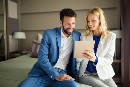 Business people in formal wear on business tripの写真素材