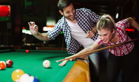 Couple playing snooker togetherの写真素材